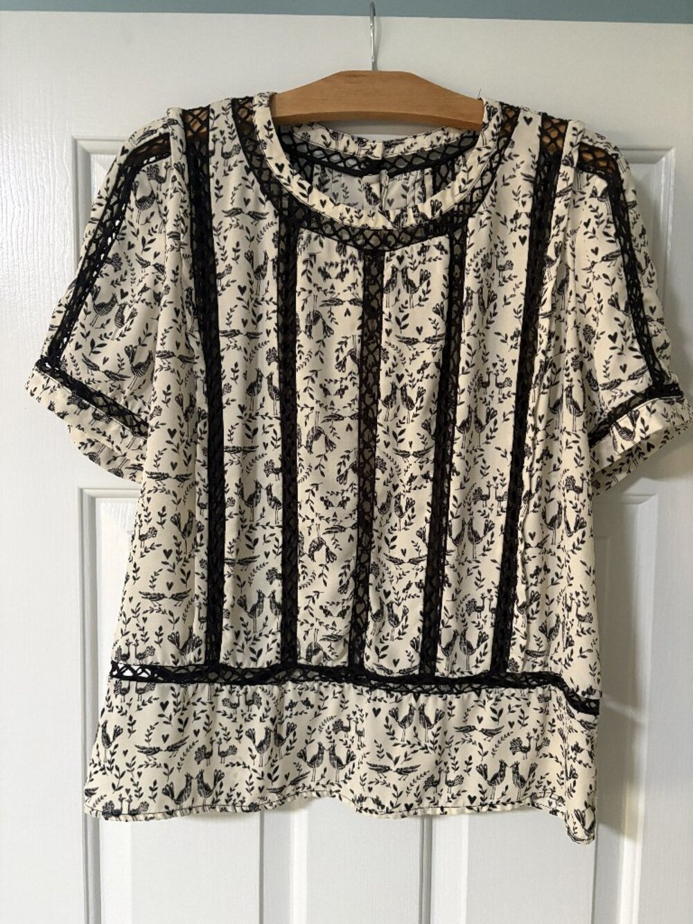Anthropologie mixed media cream and black short sleeve blouse